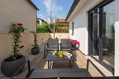 Image de Elégant appartement dans le quartier résidentiel à seulement 10 minutes de la plage