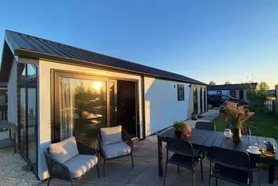 Image de New Elegant waterfront chalet with jetty Lake Kampen Netherlands vacation home boat