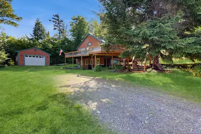 Image de Scenic retreat with a spacious deck, gas fireplace, and Moosehead Lake views