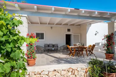 Image de Maison de vacances 'Il Melograno' avec terrasse privée, Wi-Fi et climatisation