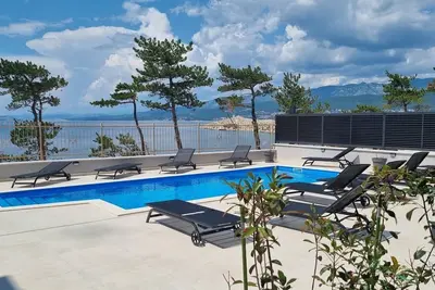 Image de Luxury Apartments Punta Silo - 30 m from the sea, sea view, swimming pool, outdoor shower, Smart Tv, laundry room, private parking