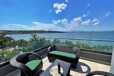 Image de Luxury Apartment Punta Silo - 30 m from the sea, sea view, swimming pool, outdoor shower, Smart Tv, laundry room, private parking
