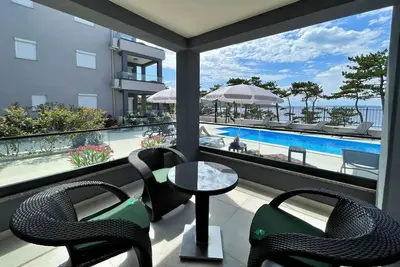 Image de Luxury Apartments Punta Silo - 30 m from the sea, sea view, swimming pool, outdoor shower, Smart Tv, laundry room, private parking