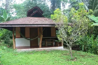 Image de Romantic bungalow in the middle of a tropical garden, close to the beach.