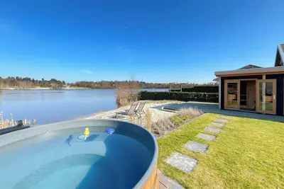 Image de Wellness house by the water with sauna, hot tub, and private beach