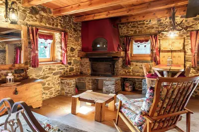 Image de Appartement 'Soggiorno Con Camera Deluxe' avec vue sur montagne, terrasse privée et jardin privé