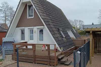 Image de Maison de vacances 'Ferienhaus Stamer Am Großen Meer' avec terrasse partagée et jardin privé