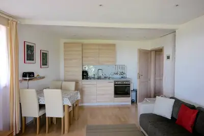 Image de Appartement \"Gartenwohnung\" avec vue sur le lac, terrasse privée et Wi-Fi