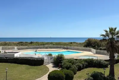 Image de Appart en rez de jardin avec Piscine en bord de plage
