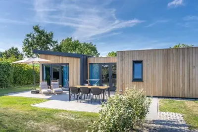 Image de Bienvenue au Muralt 110, un chalet moderne avec tout pour un séjour sans soucis. Profitez du salon c