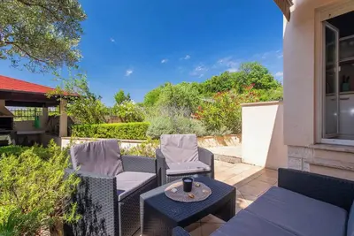 Image de Appartement de vacances Avec un magnifique jardin