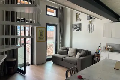 Open-plan loft overlooking Lake Como with private parking space