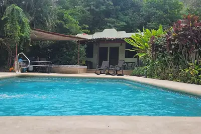 Charming poolside Coco Cottage