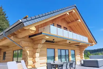 Image de Natural log cabin chalet (new build 2025! ) in the HunsrĂĽck with lake and national park views