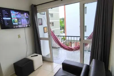 Image de Complete apartment Tortugas Guarujá 4 minutes walk from the beach, everything close by, perfect.