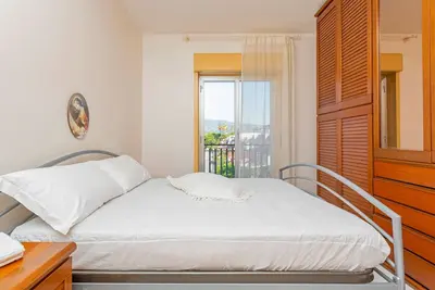 Image de Appartement 'I Ciottoli Dello Ionio - Apt 5' avec vue sur les montagnes, terrasse commune et balcon