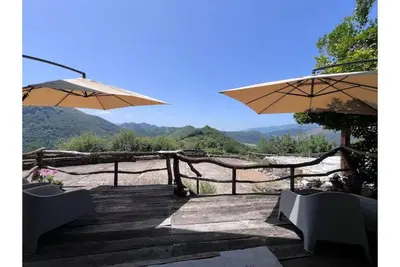 Image de A little house near the coast. Mountain views