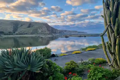 Image de 3-bed gem in Birdlings Flat with stunning lake & ocean views – a rare retreat!