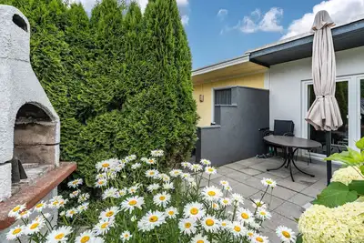 Image de Maison de vacances 'Bungalow 73' avec terrasse privée et jardin privé