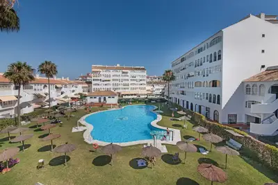 Image de Appartement 'El Portil' avec piscine partagée, Wi-Fi et climatisation