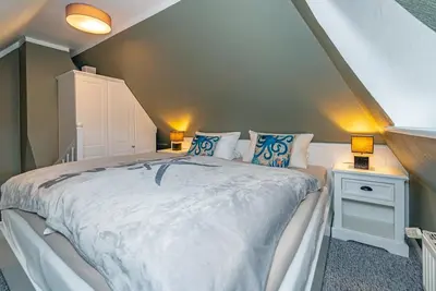 Image de Appartement 'GemĂĽtliche Wohnung' avec jardin commun et Wi-Fi