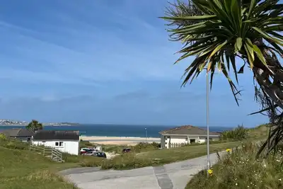 Image de Treville soaks up the sun, which can be enjoyed from the deck with sea views.