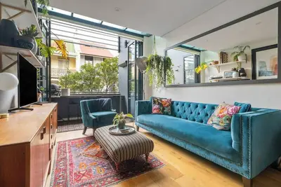 Image de Urban Jungle Loft A Leafy Alfresco Oasis