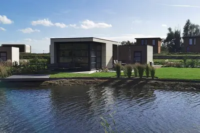 Image de Modern chalet 'Aan het Oever' with fenced garden & AirCo in Olburgen/Nl
