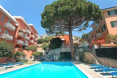 Image de Appartement 'Sole E Mare' avec piscine partagée, terrasse privée et jardin privé