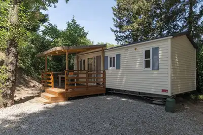 Image de Mobil-home 'F - 1-6 Pers' avec piscine commune, terrasse privée et jardin partagé