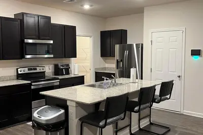 Image de Spacious 5-bedroom house within minutes of the Atl Airport