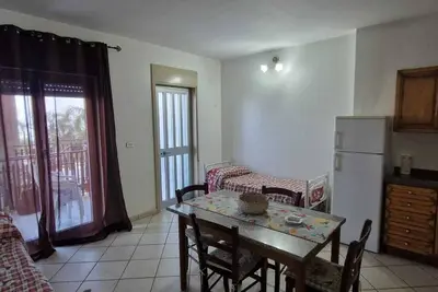 Image de Appartement 'I Ciottoli Dello Ionio - Apt 18' avec vue sur la mer, terrasse commune et balcon