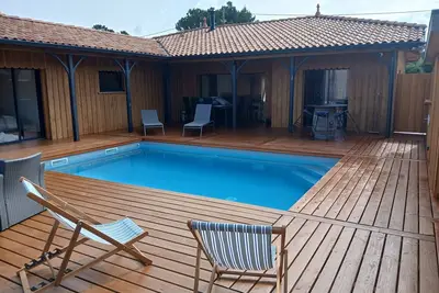 Image de Loue villa bois de standing avec piscine à Montalivet