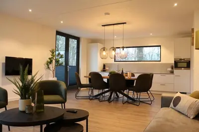 Image de Modern forest retreat with 4 bedrooms and 3 bathrooms – ideal for family holidays or group getaways in North Limburg nature.
