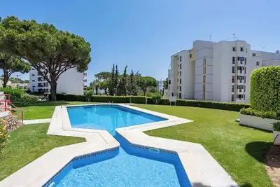 Sunny Escape with a Pool & Balcony by HostWise