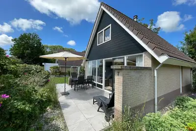 Image de 6-person holiday home with fireplace on a small holiday park, outdoor swimming pool, close to the beach, quiet area
