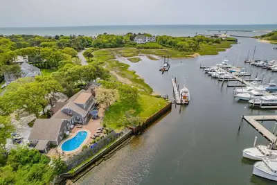 Image de Nautical retreat with water views, inground heated pool, and private beach access