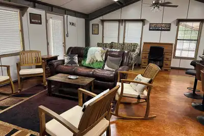 Image de Unique camp style house with large wrap around deck.
