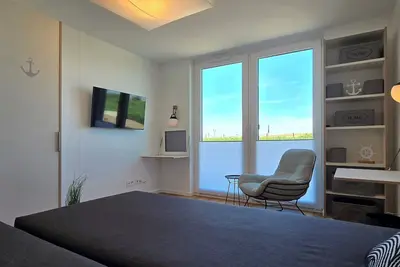 Image de Comfortable vacation apartment i10 with covered terrace in the first row of the beach