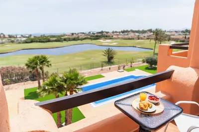 Image de Sunny apartment overlooking pool, golf course and sea.