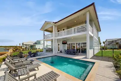 Image de Stunning canal front home with private pool, fire pit, and boat dock