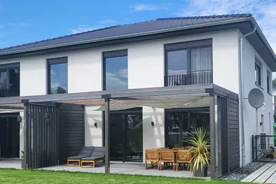 Image de Maison de vacances 'Schlossterrassen 8a' avec vue sur le lac, terrasse privée et Wi-Fi