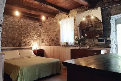 Image de Chambre 'Taverna' avec vue sur la montagne et jardin partagé