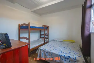 Image de Casa em Bertioga com conforto a 7 min da praia