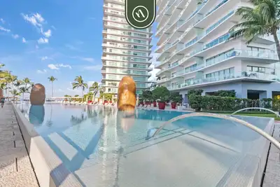 Image de Beachfront 1 Br Condo with Multiple Pools - Gym