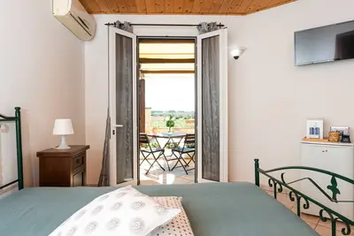 Image de Chambre 'Angeli Nel Salento - Stanza 6' avec terrasse privée, Wi-Fi et climatisation