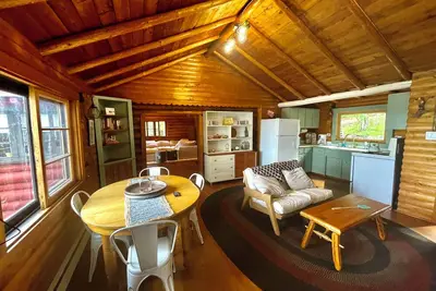 Image de Casa de Campo, a magical log cabin nestled in the woods directly on the lake.