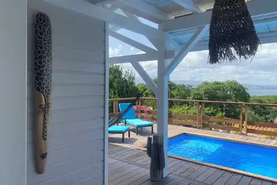 Image de Les Trois Ilets : Grande villa bois piscine vue mer 4 chambres 4 salles d’eau.
