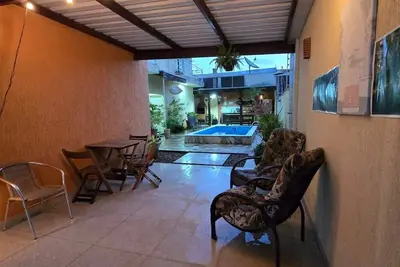 Image de Family house - Suites with air conditioning, swimming pool and barbecue, 250m from Sapê beach.
