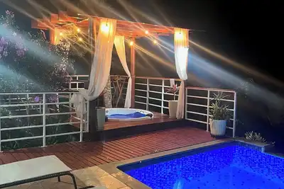 Image de Simple house with a hot tub, swimming pool and a beautiful view in Mairiporã